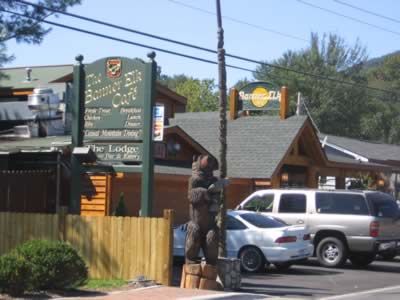 Wooden Bear with a trout stands guard at the Banner Elk Cafe